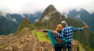 Backpackers exploring Machu Picchu on a budget travel route in Peru