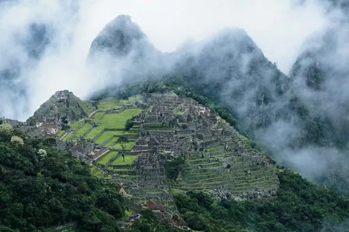 Misty morning view of Machu Picchu in the Andes Mountains.