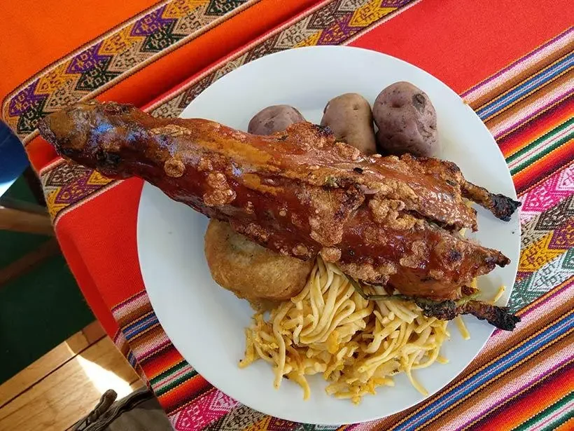 Traditional baked cuy dish served in Cusco, Peru